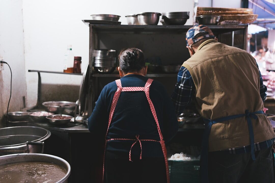 elderly couple cooking together